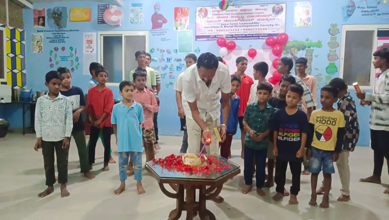 Lighting the Birthday Candle with Cheering Boys