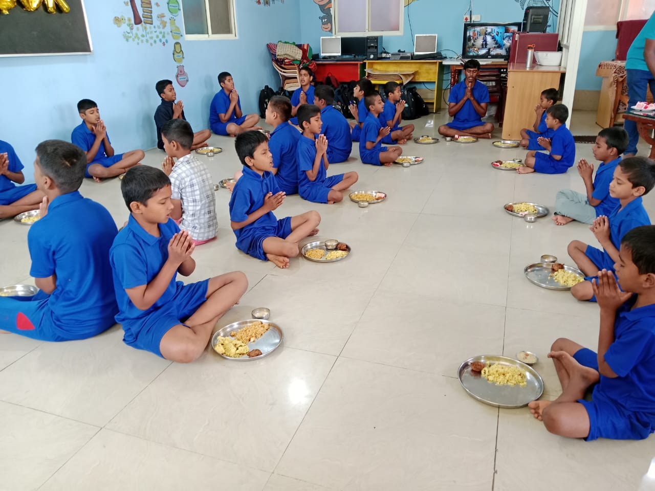 Resident orphaned boys praying with gratitude at Janaseva Ashrama Bangalore